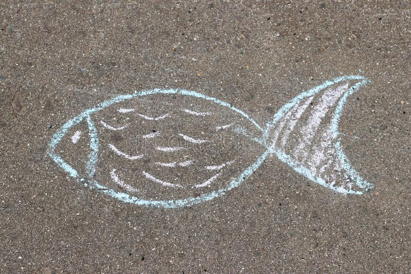 image of a fish drawn with chalk on a sidewalk