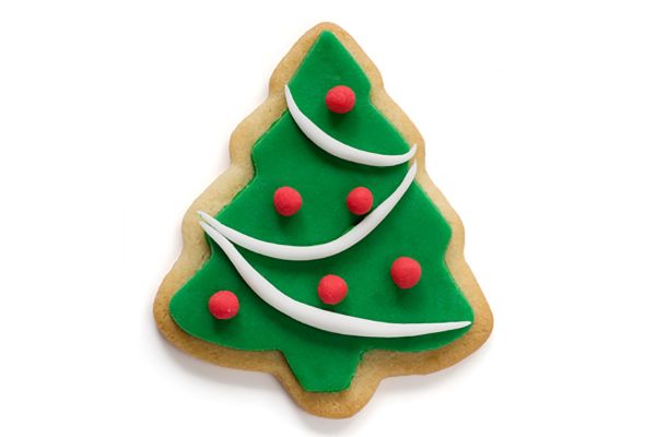 Christmas tree cut-out cookie with green frosting and decorations