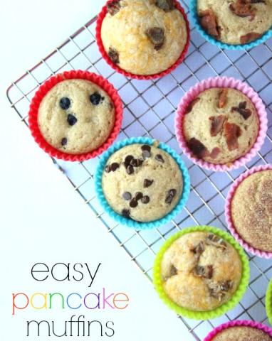 Muffins with various fruit fillings on a cooling rack