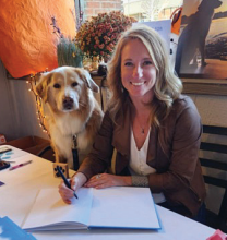 Local author Maggie Benham with her dog Tipper at a book signing