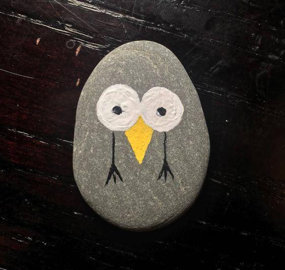 A Kindness Rock bird with BIG eyes