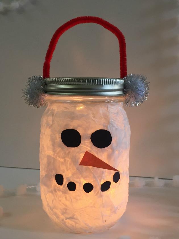 Snowman lantern made from a tissue paper covered mason jar